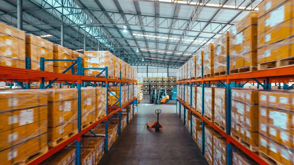 Warehouse aisle with stocked shelves for logistics and fulfillment