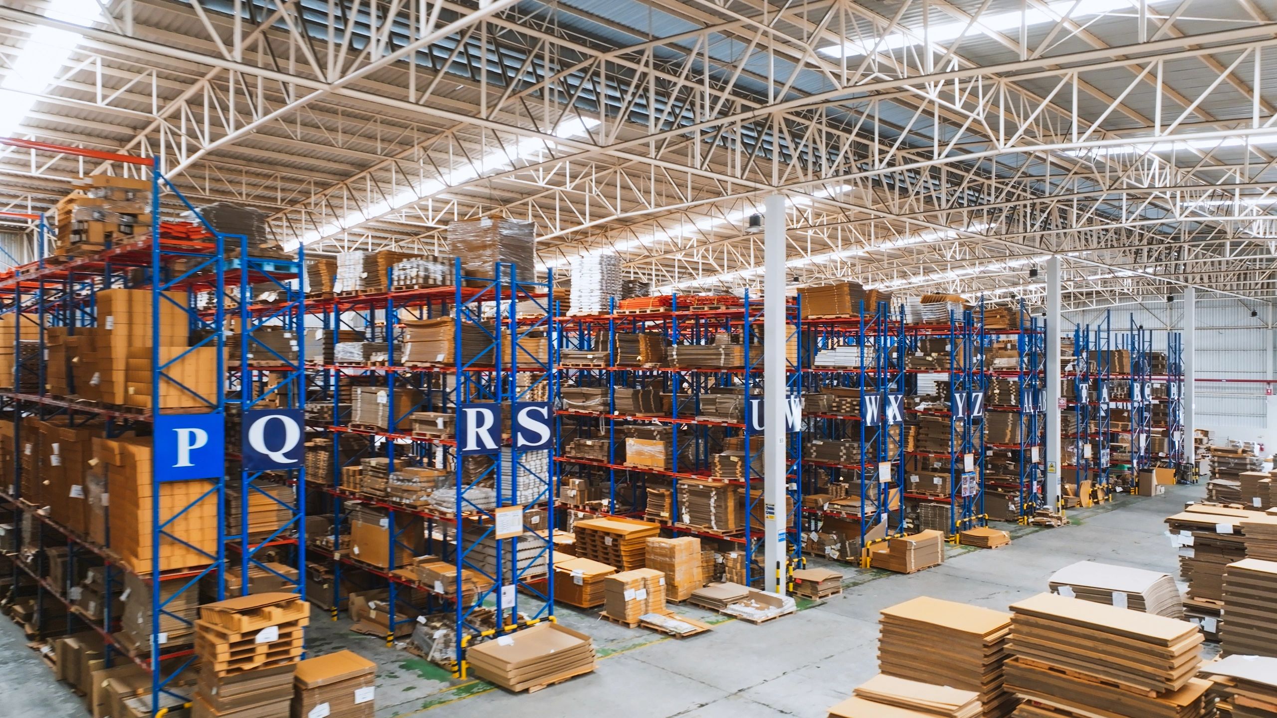 Warehouse shelving with packaged materials ready for fulfillment